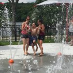 Group of teens playing at a fountain park