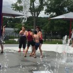 Group of teens playing at a fountain park
