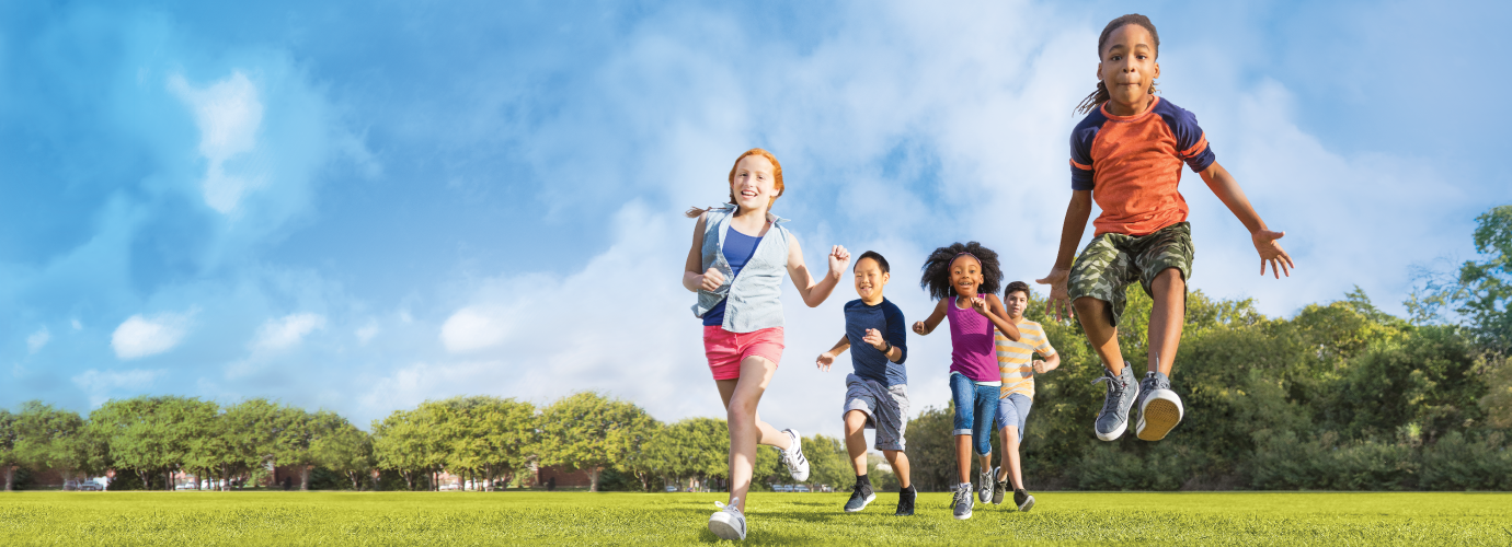 A group of kids running outside in Central Massachusetts