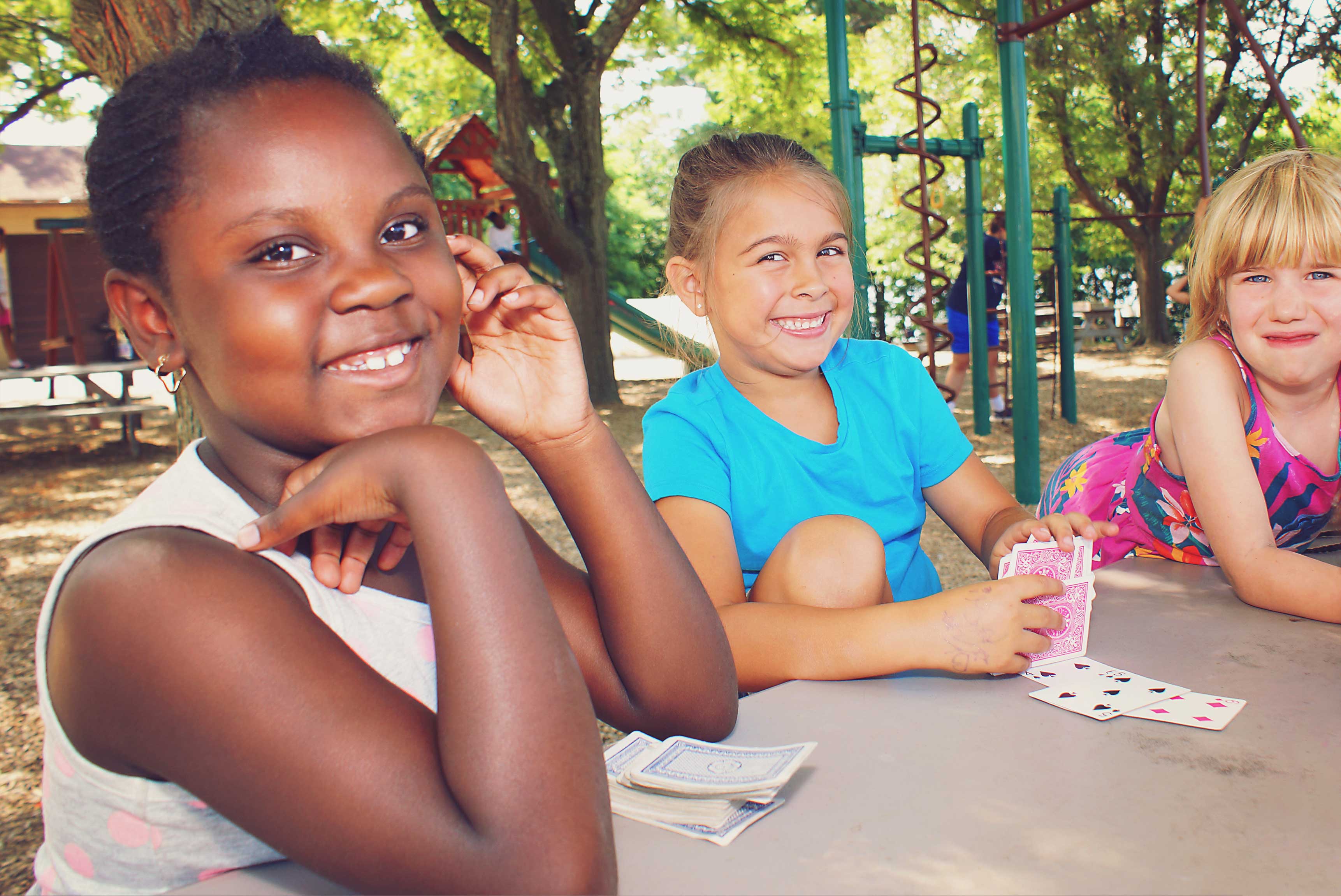 A group of students posing for a selfie during their summer camp near Indian Lake in Worcester, MA