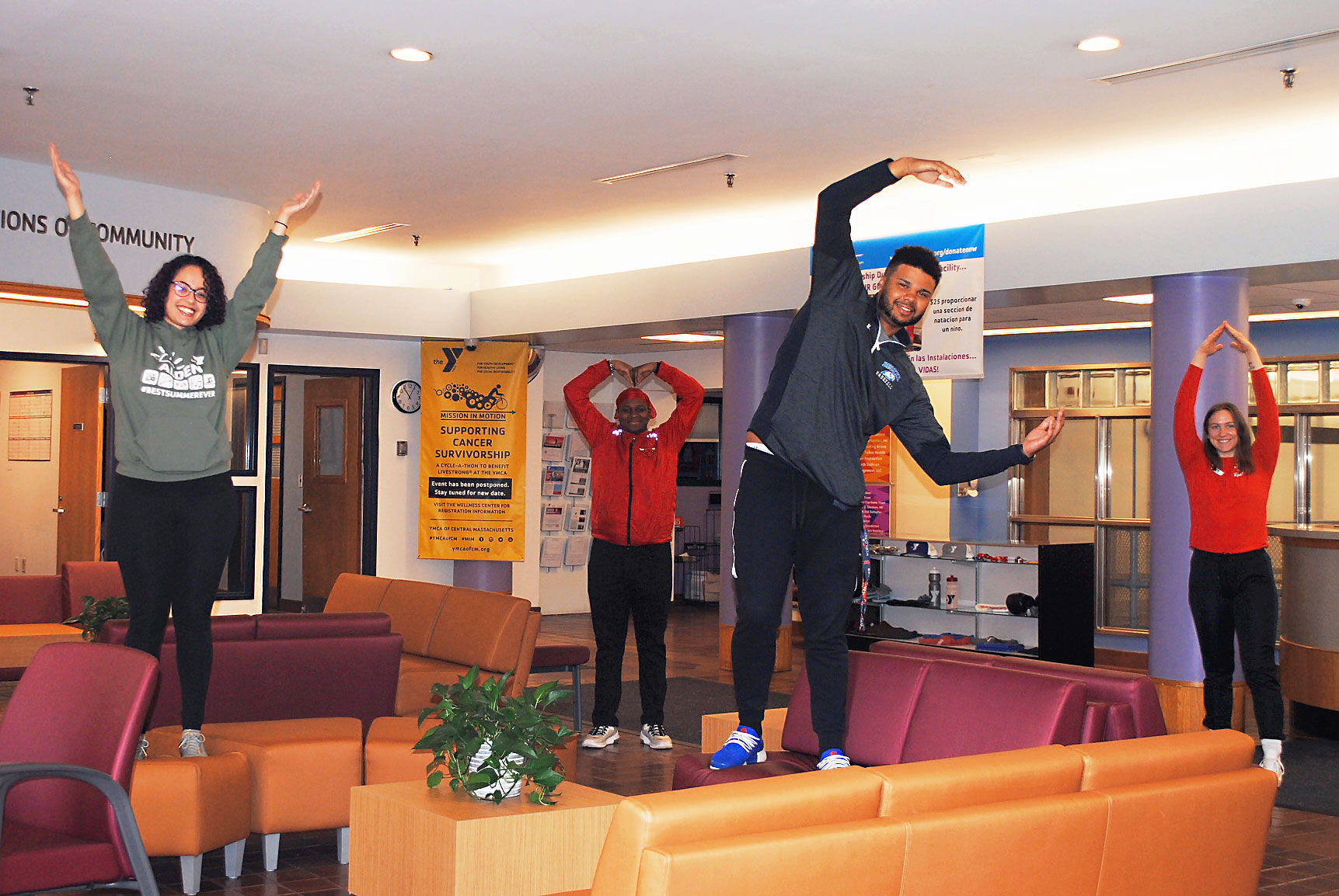 Staff-YMCA-pose-at-a-distance Staff-YMCA-pose-at-a-distance