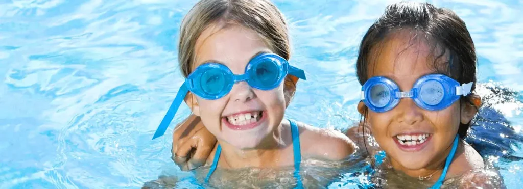Two little girls in swimming pool
