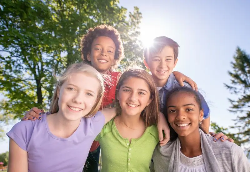 Ethnic group of elementary school children enjoying the outdoors