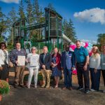 Tri-Community YMCA Playground ribbon cutting ceremony with staff and community leaders