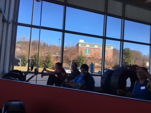 A group of people exercising at a gym in Central Massachusetts