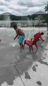 A group of children enjoying water attractions at a water park in Central Massachusetts
