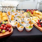 Colorful food display with fruit, crackers, and appetizers at the YMCA gathering