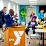 Presenter speaking at the YMCA of Central Massachusetts event podium
