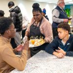 Attendees receiving appetizers during the YMCA of Central Massachusetts event