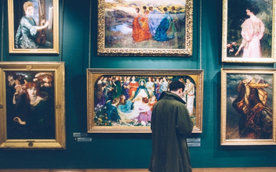 A moment of a visitor contemplating Art within a Museum Gallery