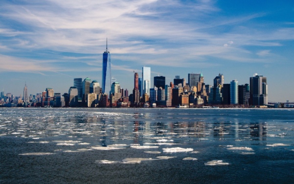Lower Manhattan skyline with One World Trade Center across the frozen Hudson River