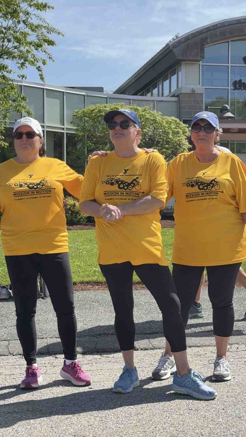 Participants wearing yellow shirts at the YMCA Mission in Motion outdoor community fundraising event