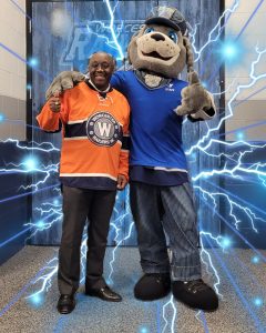 Photo of YMCA CEO and the Railers Mascot