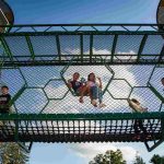 Kids playing on the new playground at TriCommunity YMCA