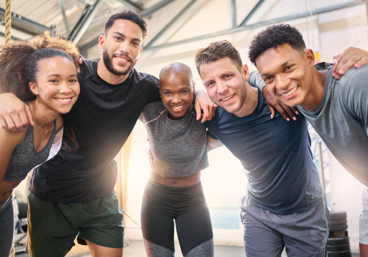 Diverse group of people having a group hug