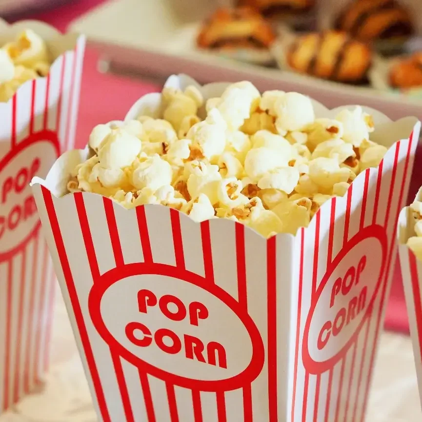 Popcorn in a red and white striped container